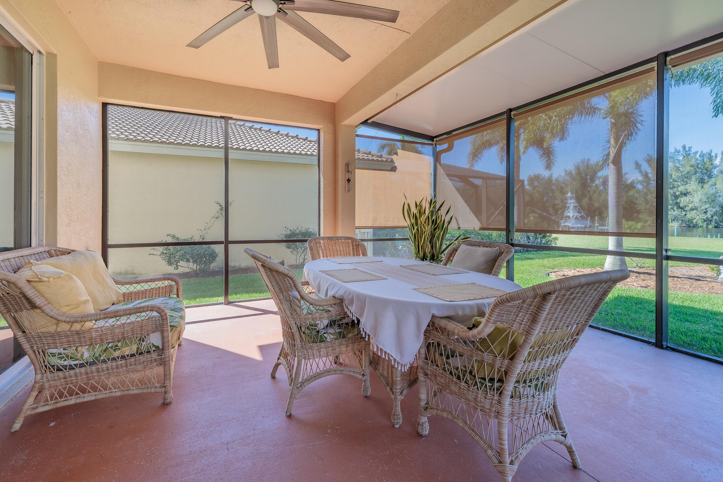 3285 Southwest Porpoise Circle Stuart, FL 34997 - Photo 38 of 69 a view of a patio with a table chairs and a backyard