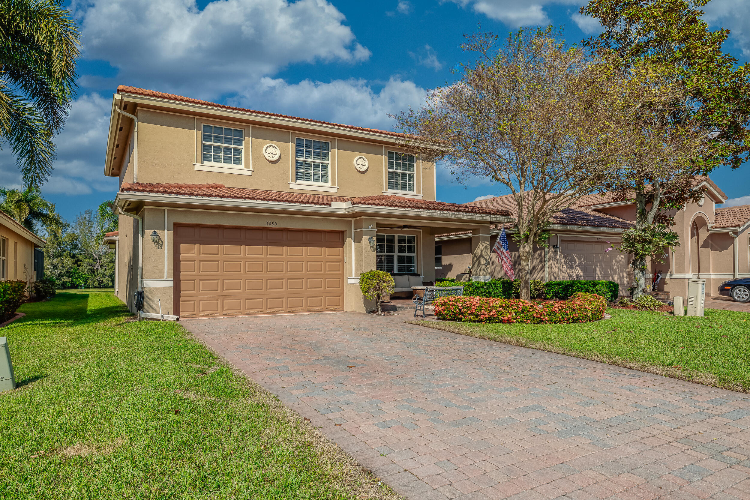 3285 Southwest Porpoise Circle Stuart, FL 34997 - Photo 4 of 69 a front view of house with yard and green space