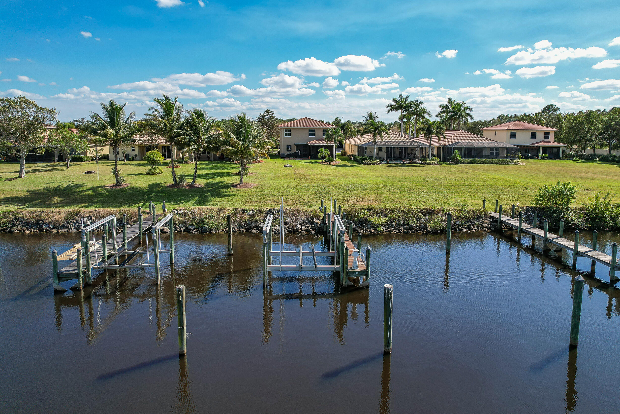 3285 Southwest Porpoise Circle Stuart, FL 34997 - Photo 56 of 69 a view of a lake with a big yard