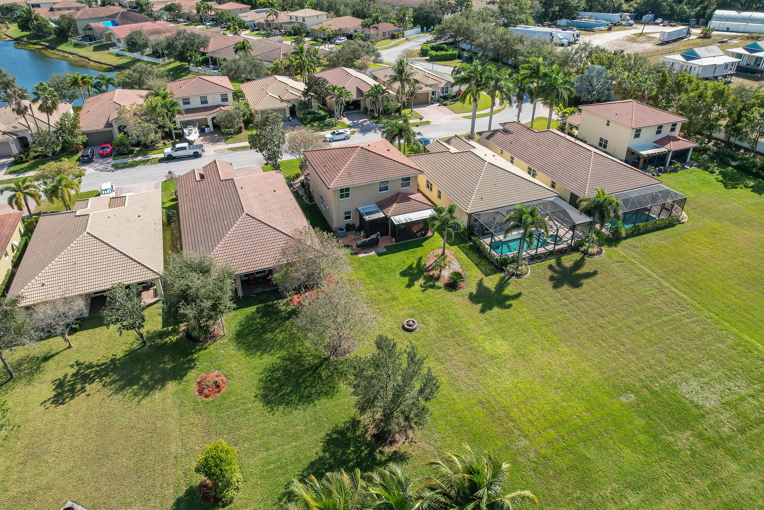 3285 Southwest Porpoise Circle Stuart, FL 34997 - Photo 62 of 69 an aerial view of residential houses with outdoor space and swimming pool