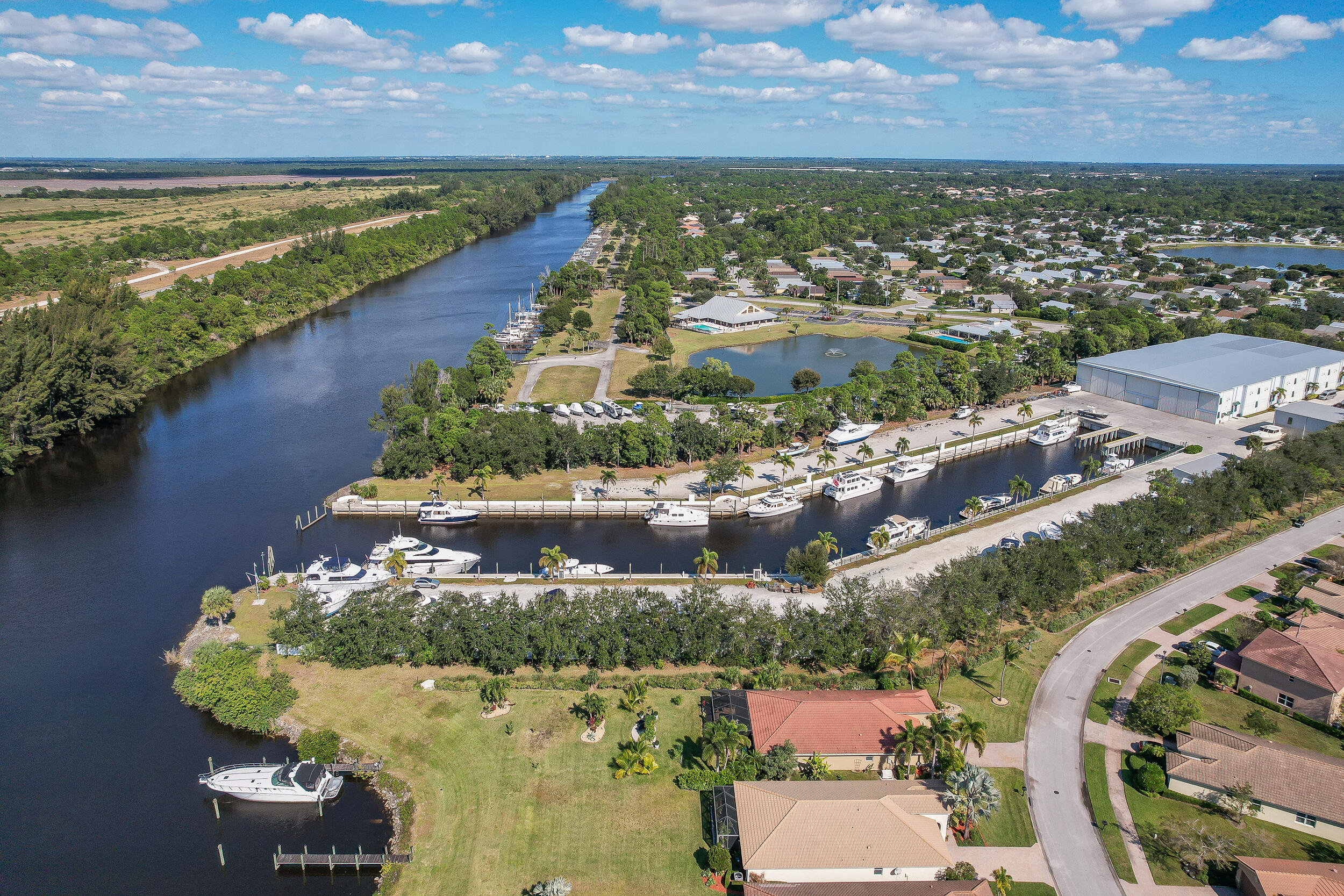 3285 Southwest Porpoise Circle Stuart, FL 34997 - Photo 68 of 69 an aerial view of a house with a lake view