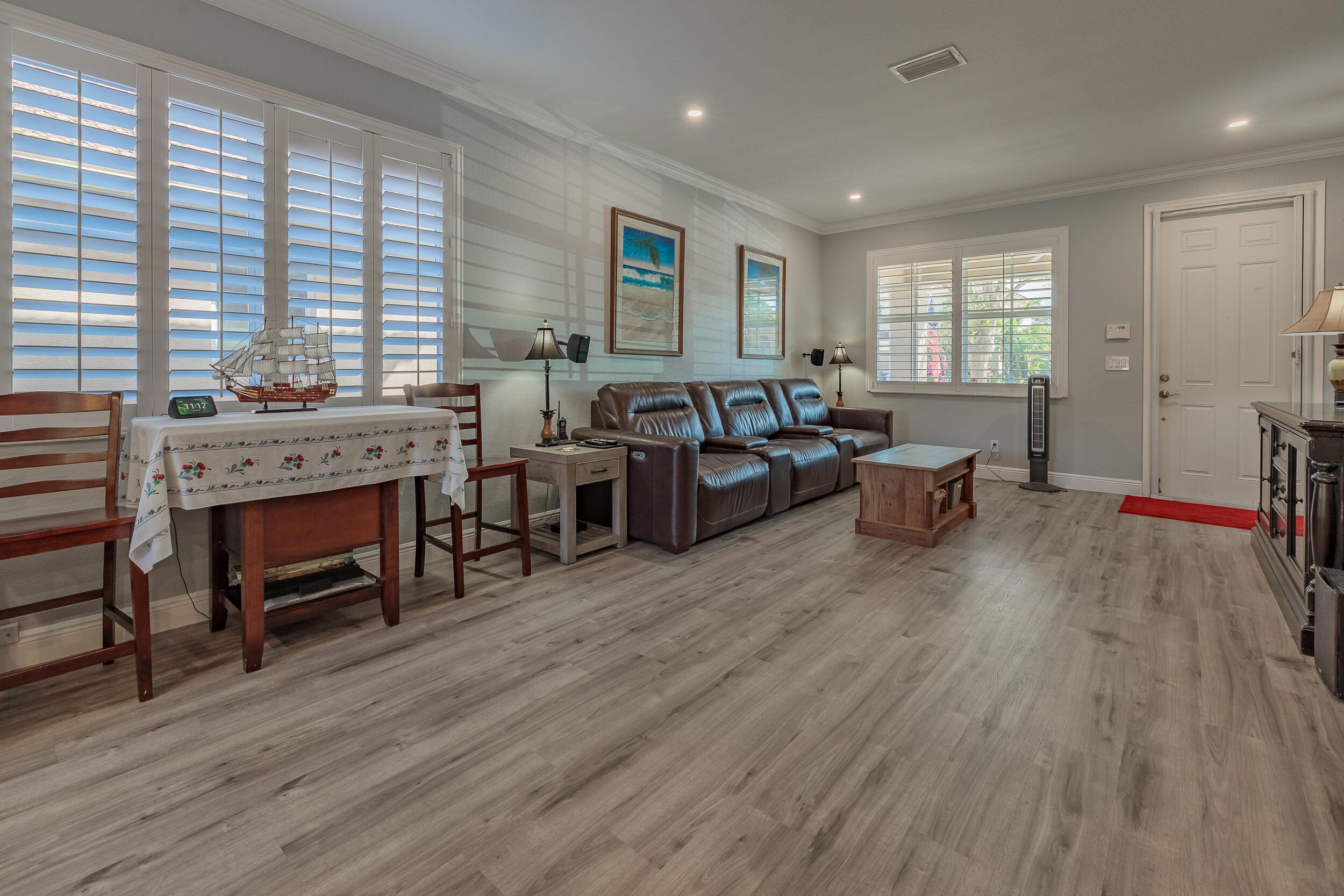 3285 Southwest Porpoise Circle Stuart, FL 34997 - Photo 8 of 69 a living room with furniture and a fireplace