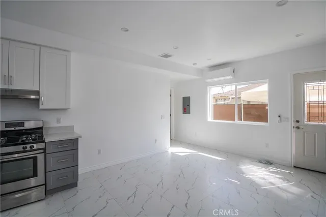 a view of an empty room with a window