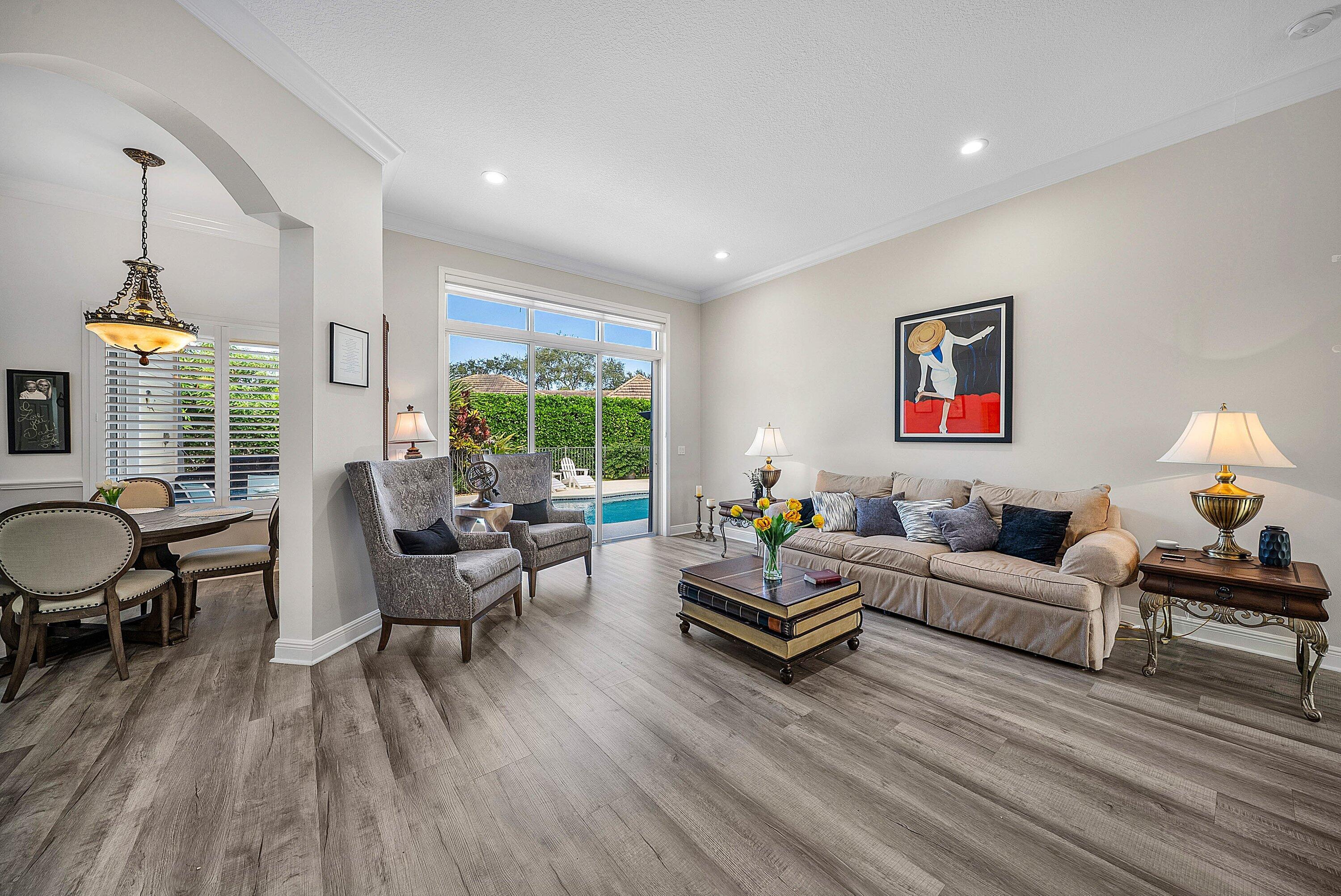 18670 Southeast Lakeside Way Jupiter, FL 33469 - Photo 11 of 56 a living room with furniture and a large window