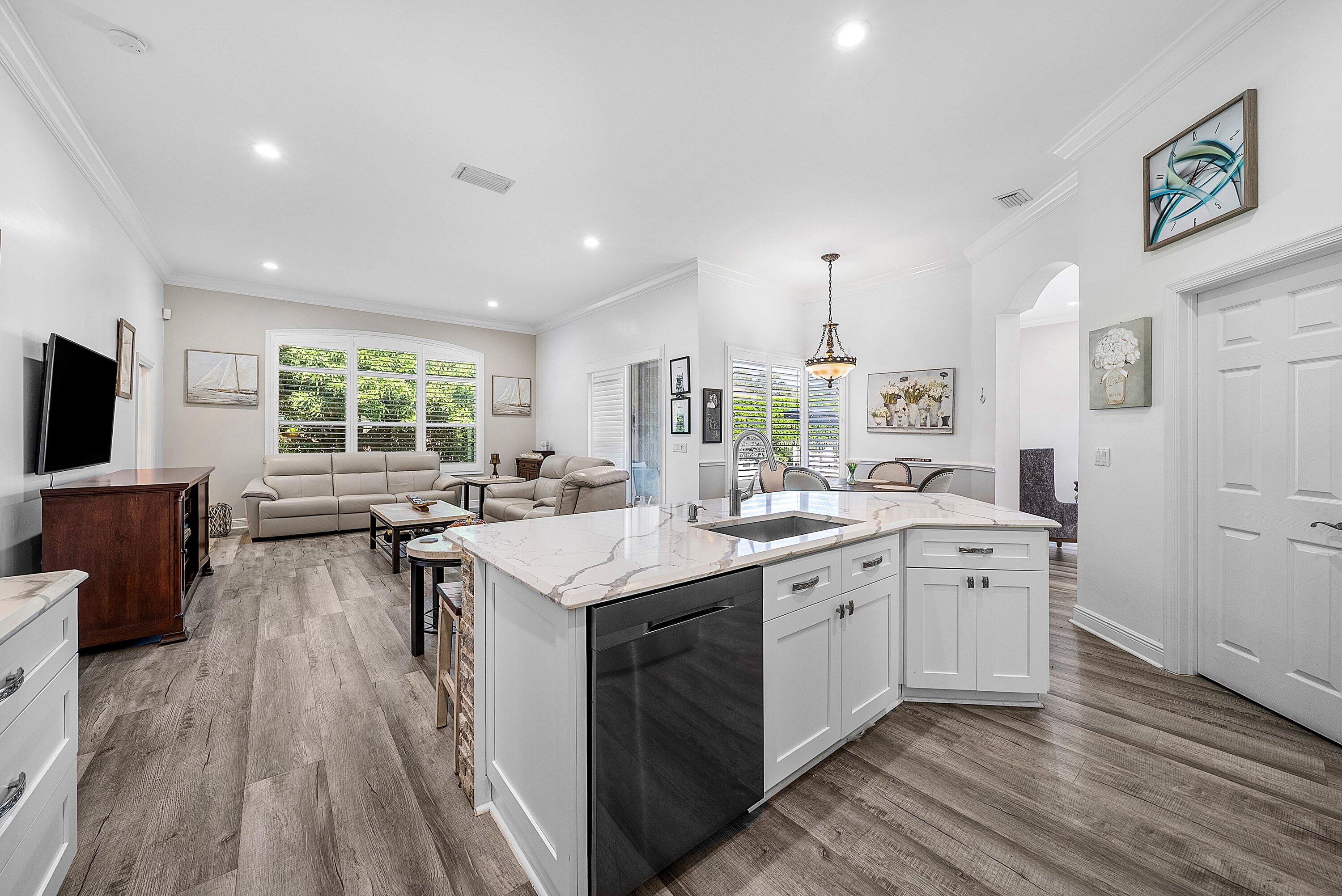 18670 Southeast Lakeside Way Jupiter, FL 33469 - Photo 17 of 56 a kitchen with sink stove and cabinets