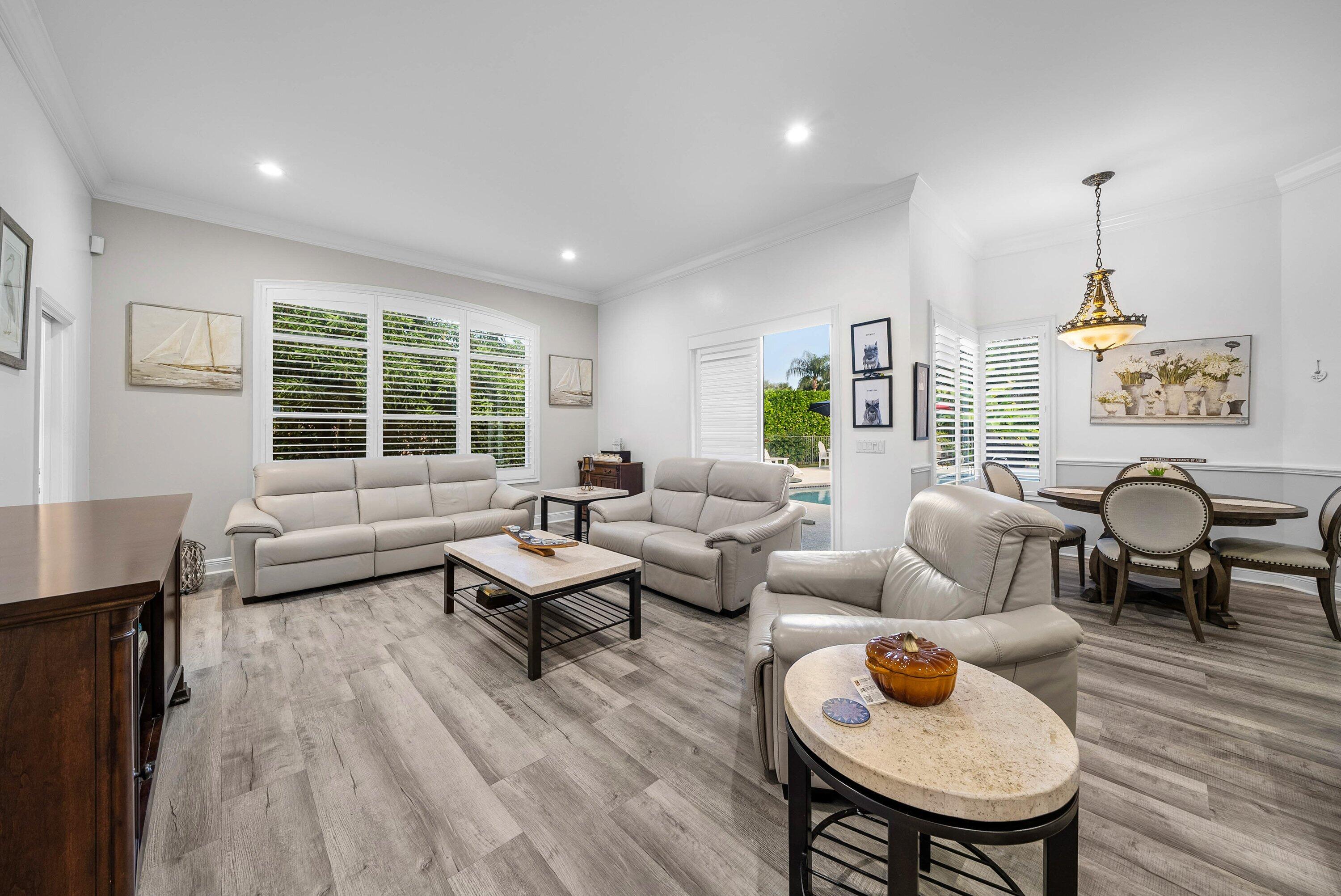 18670 Southeast Lakeside Way Jupiter, FL 33469 - Photo 18 of 56 a living room with furniture and a wooden floor