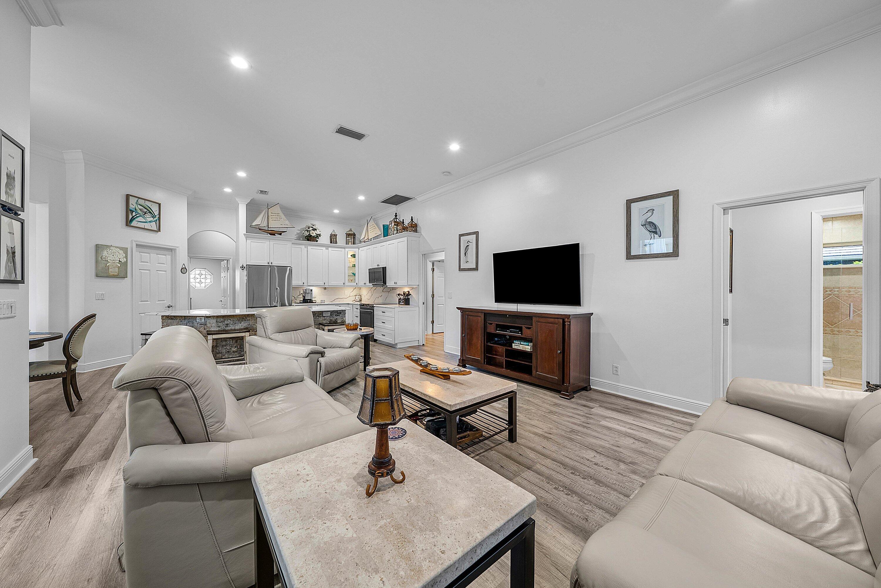 18670 Southeast Lakeside Way Jupiter, FL 33469 - Photo 20 of 56 a living room with furniture and a flat screen tv