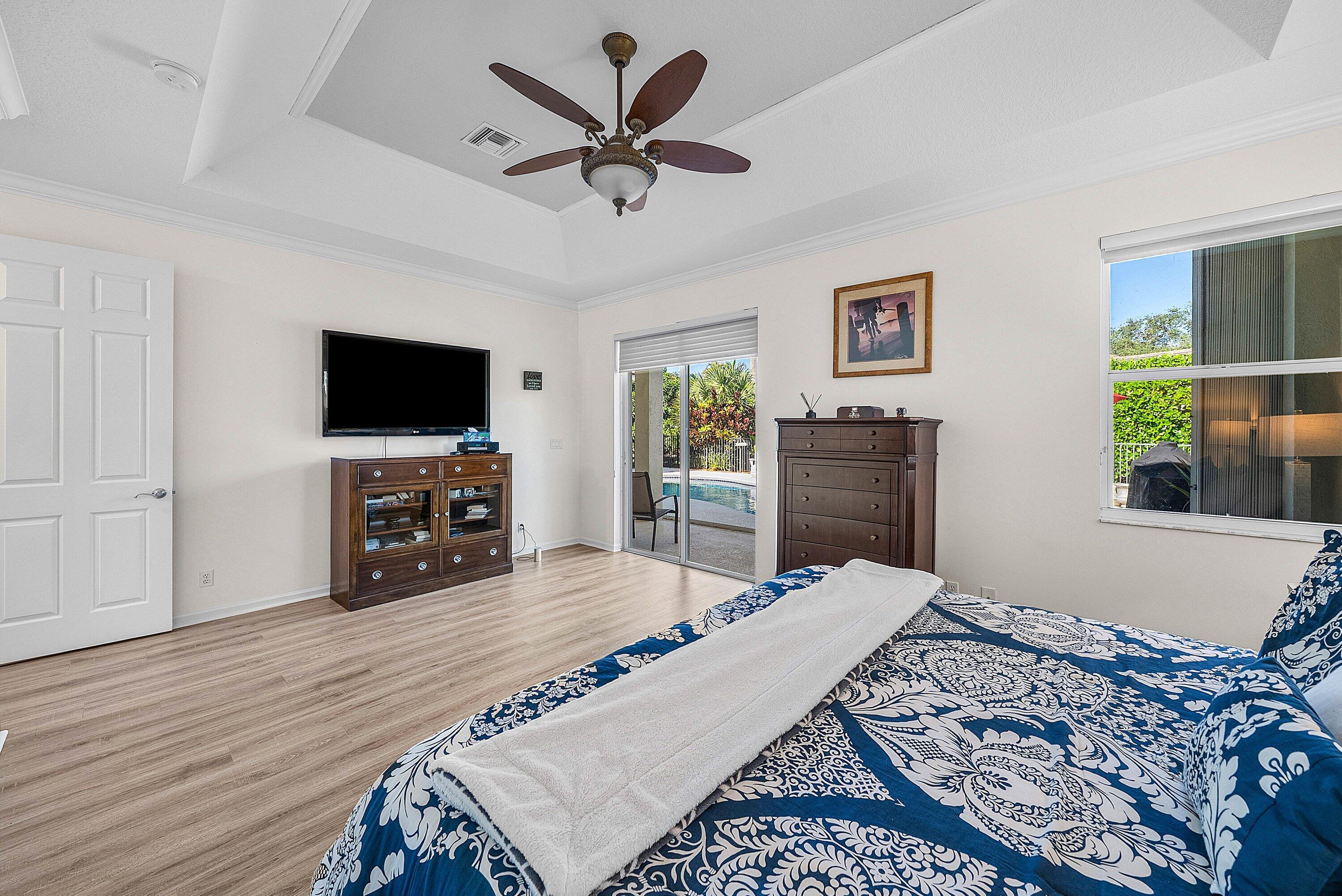 18670 Southeast Lakeside Way Jupiter, FL 33469 - Photo 22 of 56 a bedroom with a bed and a flat screen tv