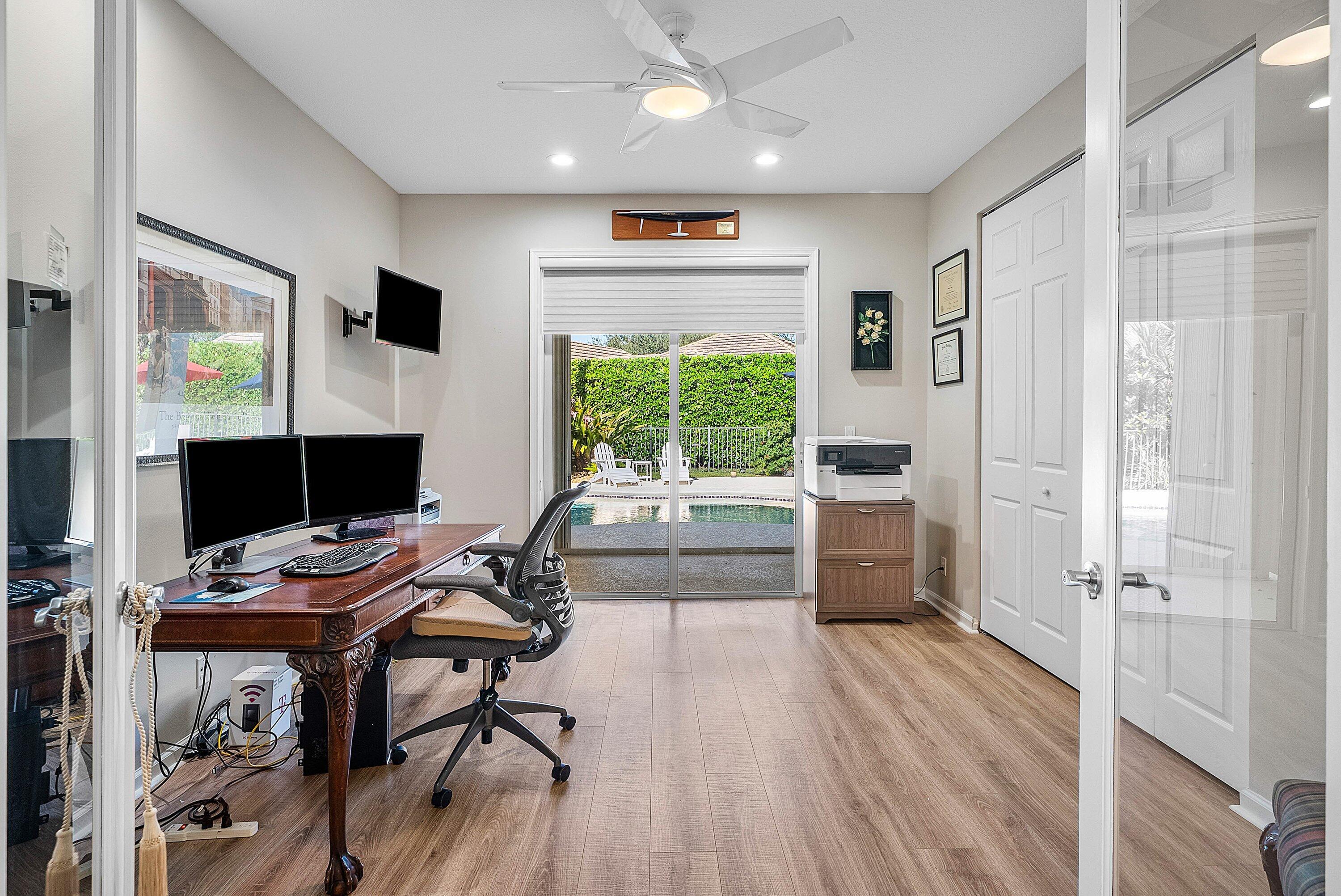 18670 Southeast Lakeside Way Jupiter, FL 33469 - Photo 31 of 56 a view of a workspace with furniture and a window