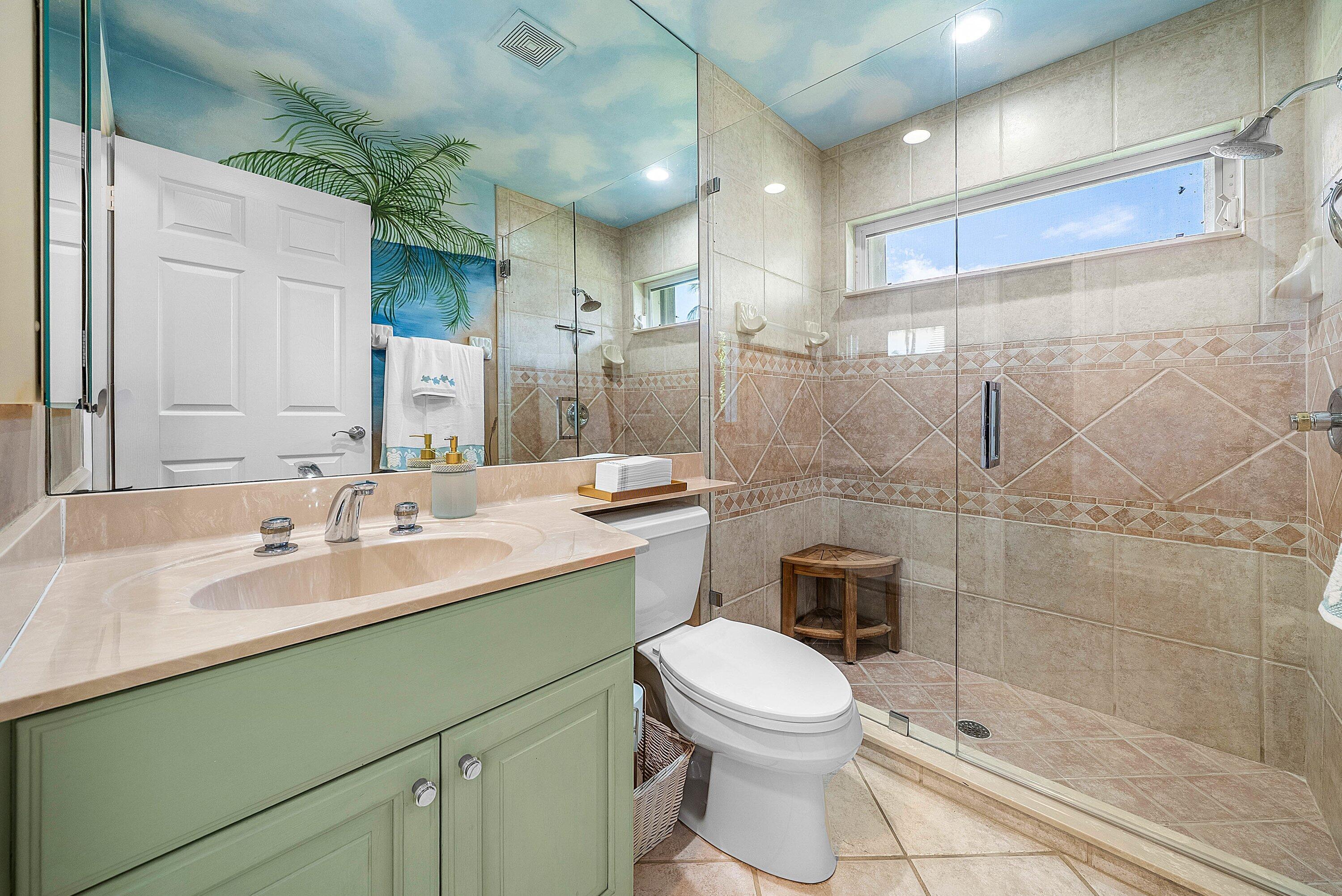 18670 Southeast Lakeside Way Jupiter, FL 33469 - Photo 33 of 56 a bathroom with a sink a toilet and shower