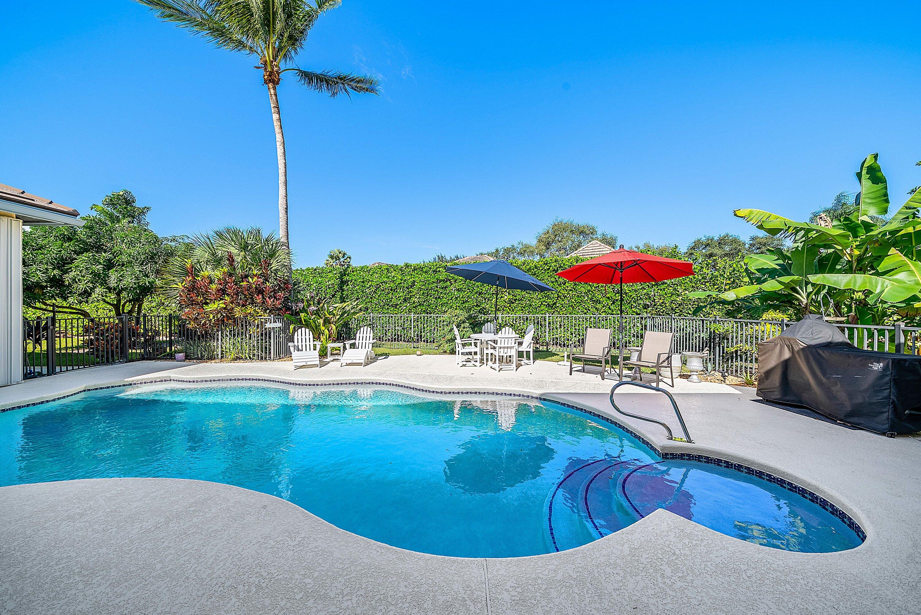 18670 Southeast Lakeside Way Jupiter, FL 33469 - Photo 42 of 56 a view of a swimming pool with a patio