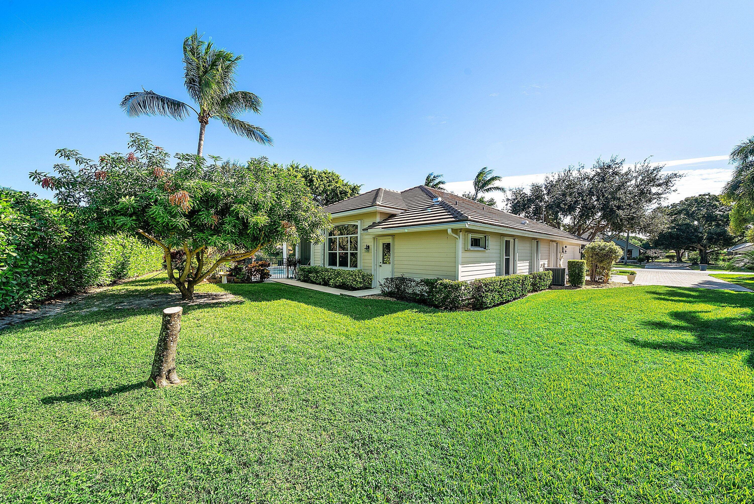 18670 Southeast Lakeside Way Jupiter, FL 33469 - Photo 43 of 56 a view of a house with a yard