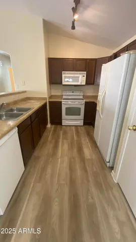 a view of a kitchen with a sink