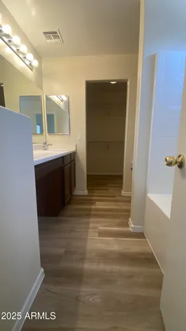a bathroom with a bath tub and a shower