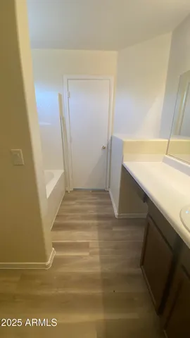 a white toilet sitting next to a shower