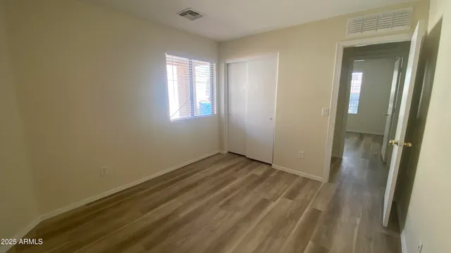 a view of wooden house with a snow on the road