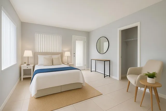 a bedroom with a bed a mirror and chair