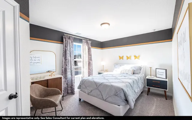 a bedroom with a bed and chair