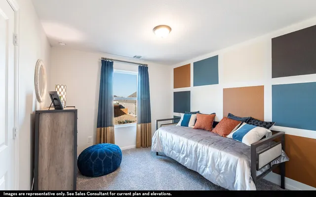 a living room with furniture and a lamp