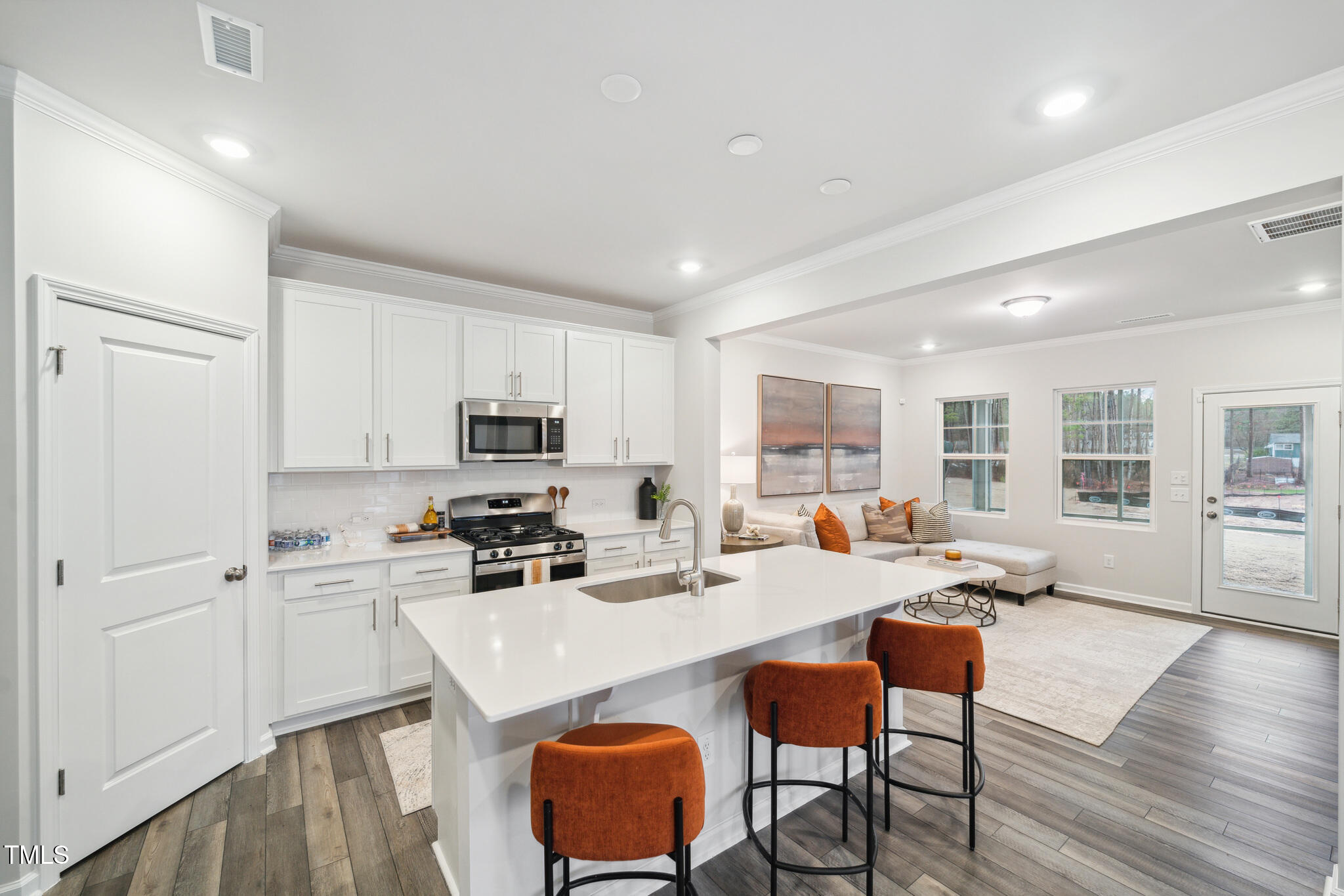1422 Maple Br Circle Graham, NC 27253 - Photo 13 of 45 a kitchen with a dining table chairs and refrigerator