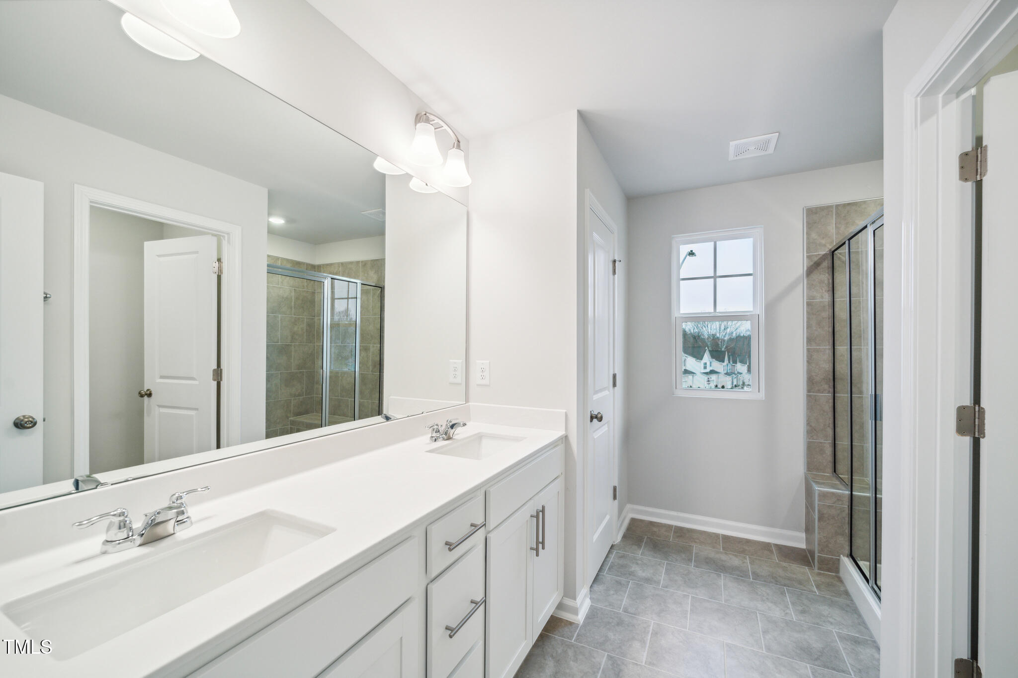 1422 Maple Br Circle Graham, NC 27253 - Photo 25 of 45 a bathroom with a double vanity sink mirror and double