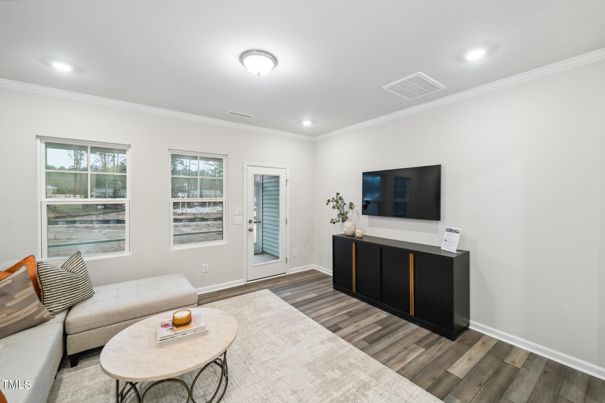 1422 Maple Br Circle Graham, NC 27253 - Photo 29 of 45 a living room with furniture and a flat screen tv