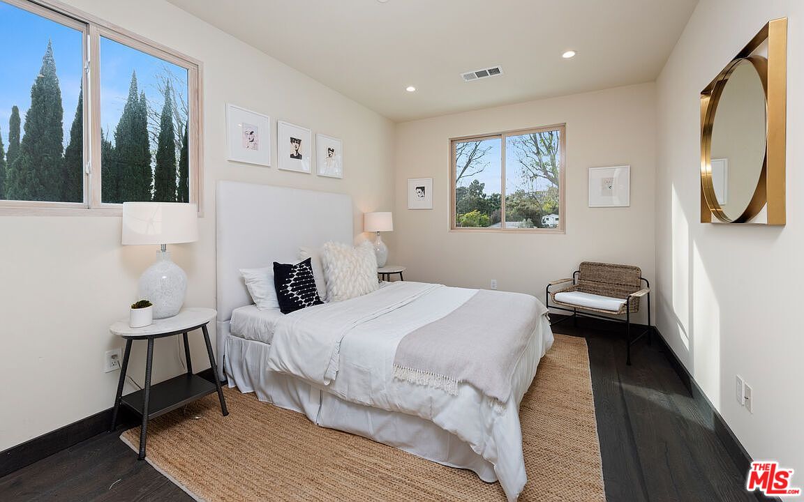 2408 Castle Heights Avenue Los Angeles, CA 90034 - Photo 18 of 28 a bedroom with a bed and a large window