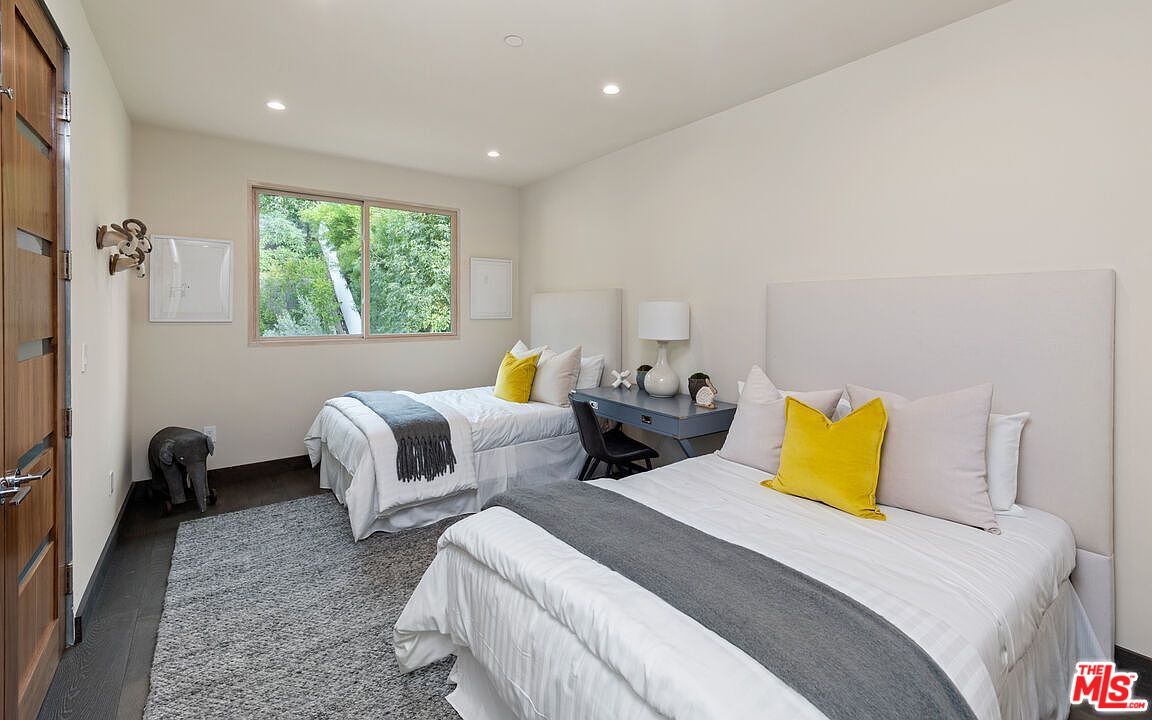 2408 Castle Heights Avenue Los Angeles, CA 90034 - Photo 27 of 28 a bedroom with two beds and painted walls