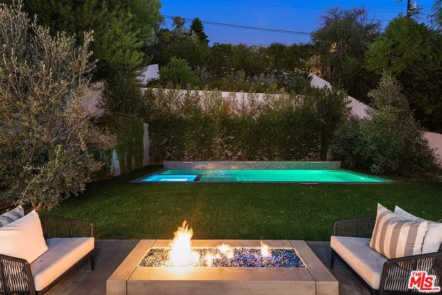 a view of a two chairs in a yard