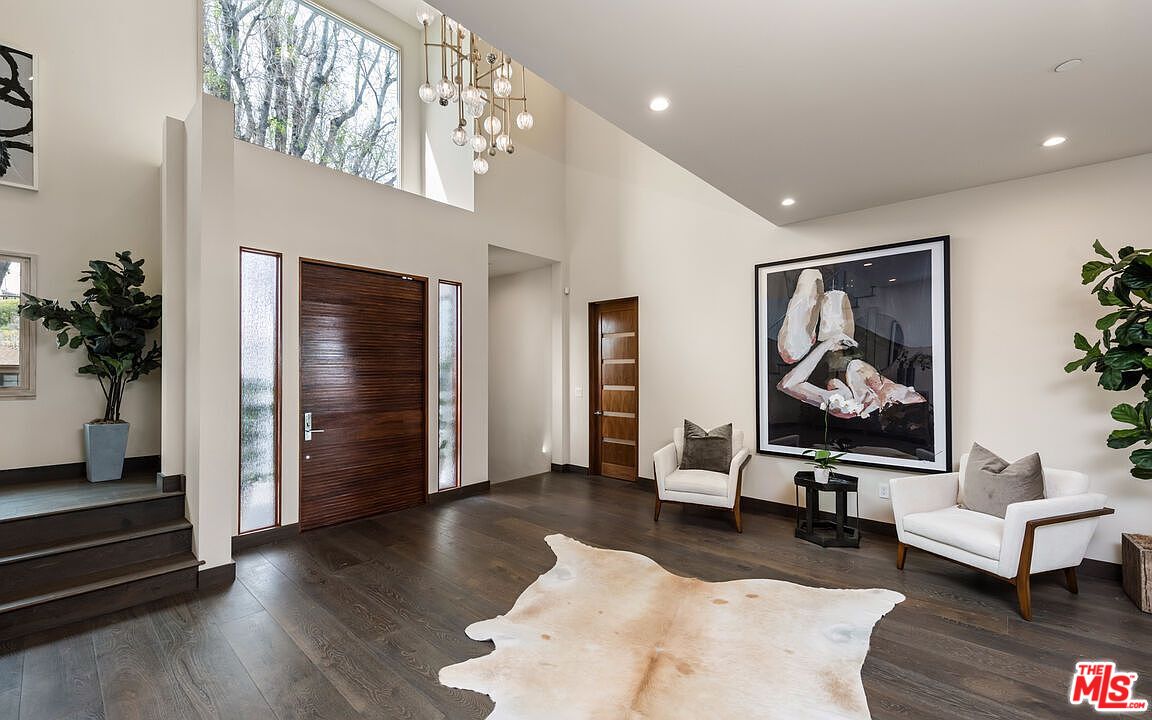 2408 Castle Heights Avenue Los Angeles, CA 90034 - Photo 5 of 28 a living room with furniture and a large window