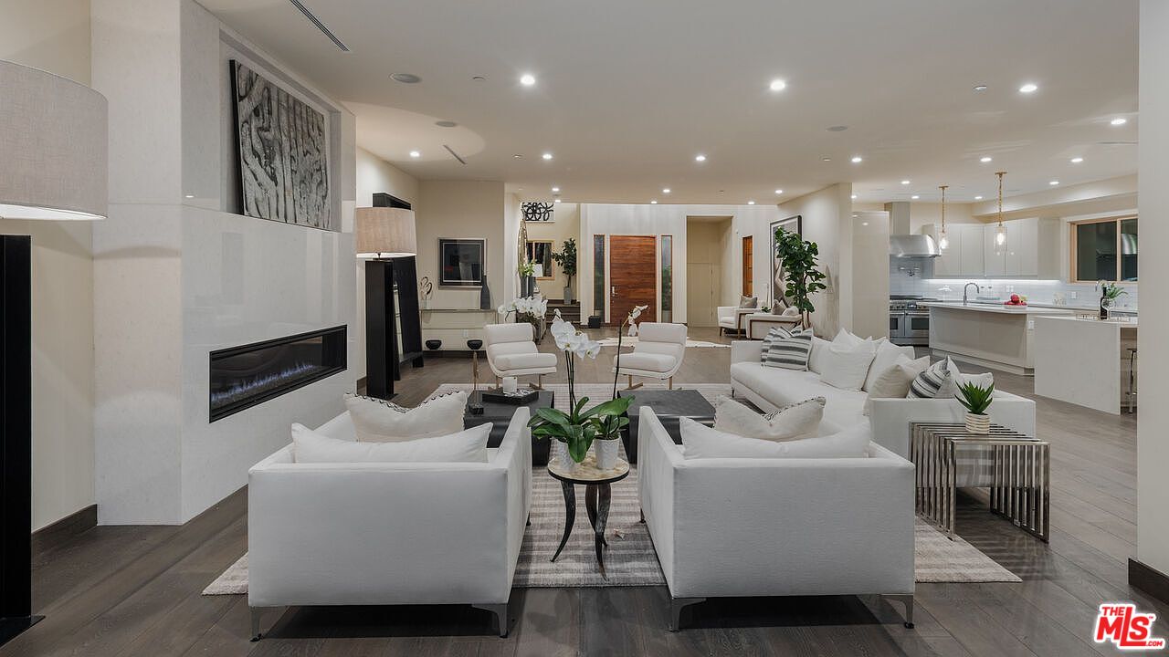 2408 Castle Heights Avenue Los Angeles, CA 90034 - Photo 6 of 28 a living room with furniture a couch and a view of kitchen