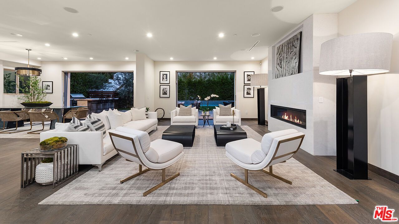 2408 Castle Heights Avenue Los Angeles, CA 90034 - Photo 8 of 28 a living room with fireplace furniture and a flat screen tv