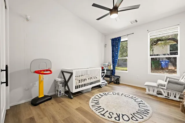 a bedroom with furniture and a window