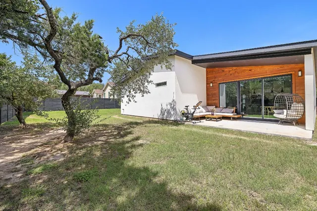 a view of a backyard with a garden and plants