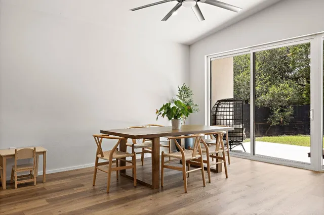 a view of a dining room with furniture window and outside view