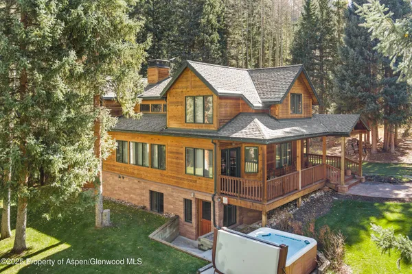 aerial view of a house with a yard