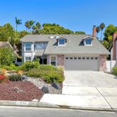 front view of a house with a small yard