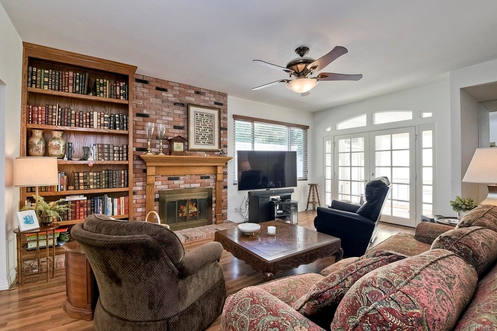 2270 Valley Road Oceanside, CA 92056 - Photo 13 of 37 a living room with furniture a fireplace and a flat screen tv