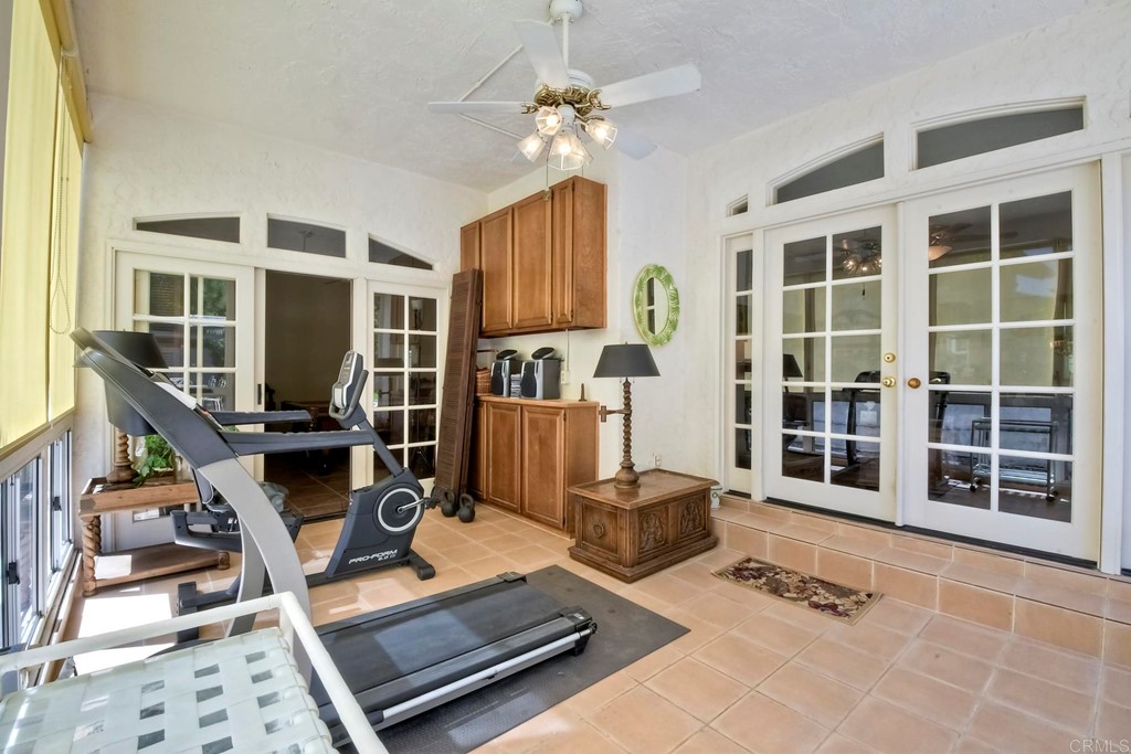 2270 Valley Road Oceanside, CA 92056 - Photo 20 of 37 a room with gym equipment and a large window