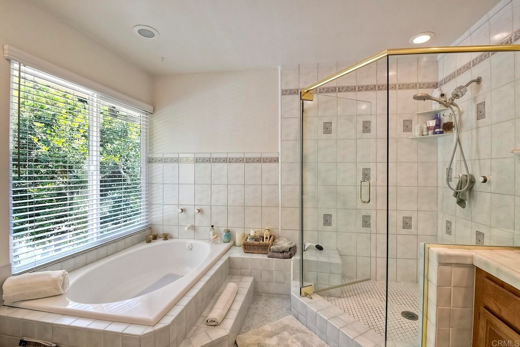 2270 Valley Road Oceanside, CA 92056 - Photo 29 of 37 a bathroom with a tub and shower