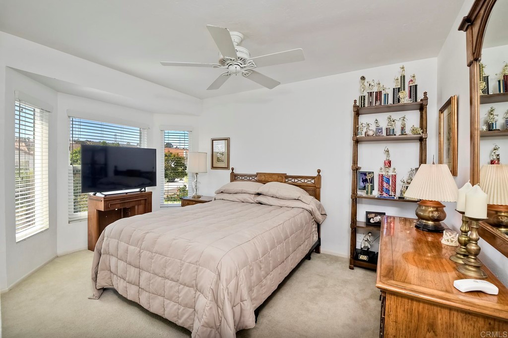 2270 Valley Road Oceanside, CA 92056 - Photo 33 of 37 a bedroom with a bed and a flat tv screen on dresser
