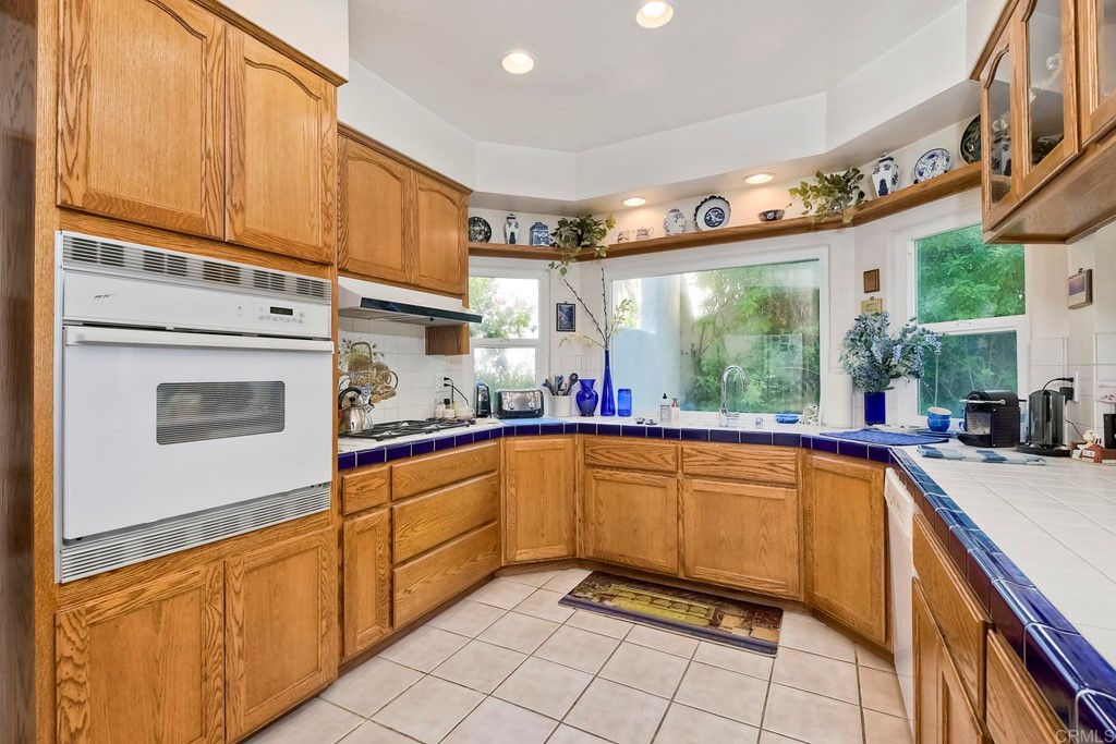 2270 Valley Road Oceanside, CA 92056 - Photo 7 of 37 a kitchen with a sink cabinets and window