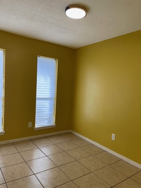 12019 Kings Grove Drive Houston, TX 77044 - Photo 12 of 50 an empty room with windows