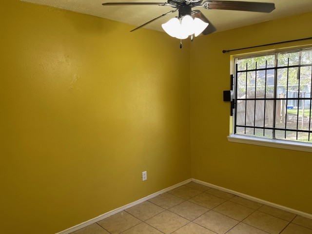 12019 Kings Grove Drive Houston, TX 77044 - Photo 13 of 50 a view of a room with a window and chandelier