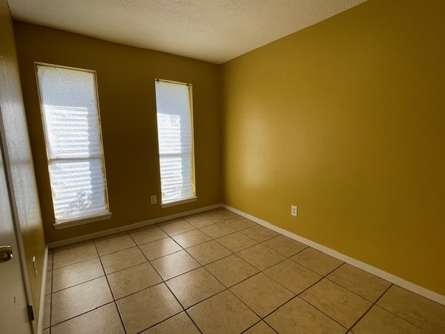 12019 Kings Grove Drive Houston, TX 77044 - Photo 19 of 50 a view of an empty room with a window