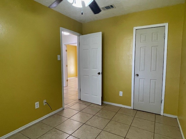 12019 Kings Grove Drive Houston, TX 77044 - Photo 36 of 50 a view of an empty room with window and chandelier fan