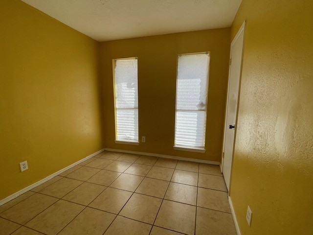 12019 Kings Grove Drive Houston, TX 77044 - Photo 37 of 50 a view of an empty room with a window