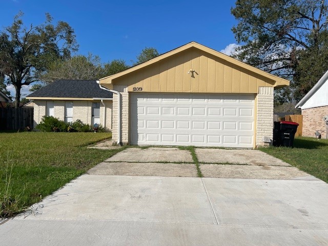12019 Kings Grove Drive Houston, TX 77044 - Photo 41 of 50 a front view of a house with a yard and garage