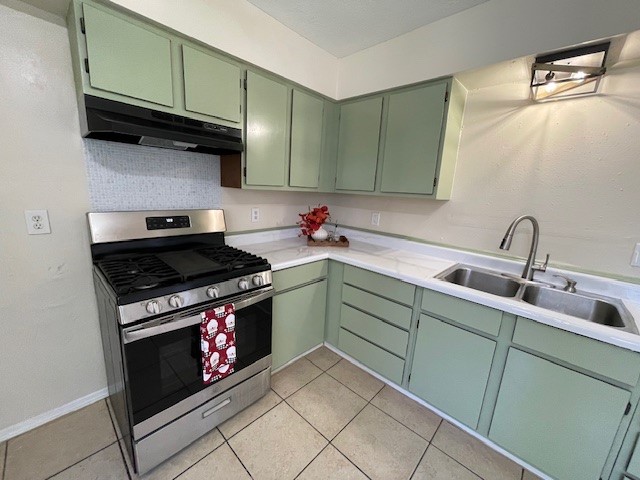 12019 Kings Grove Drive Houston, TX 77044 - Photo 49 of 50 a kitchen with a stove and a sink