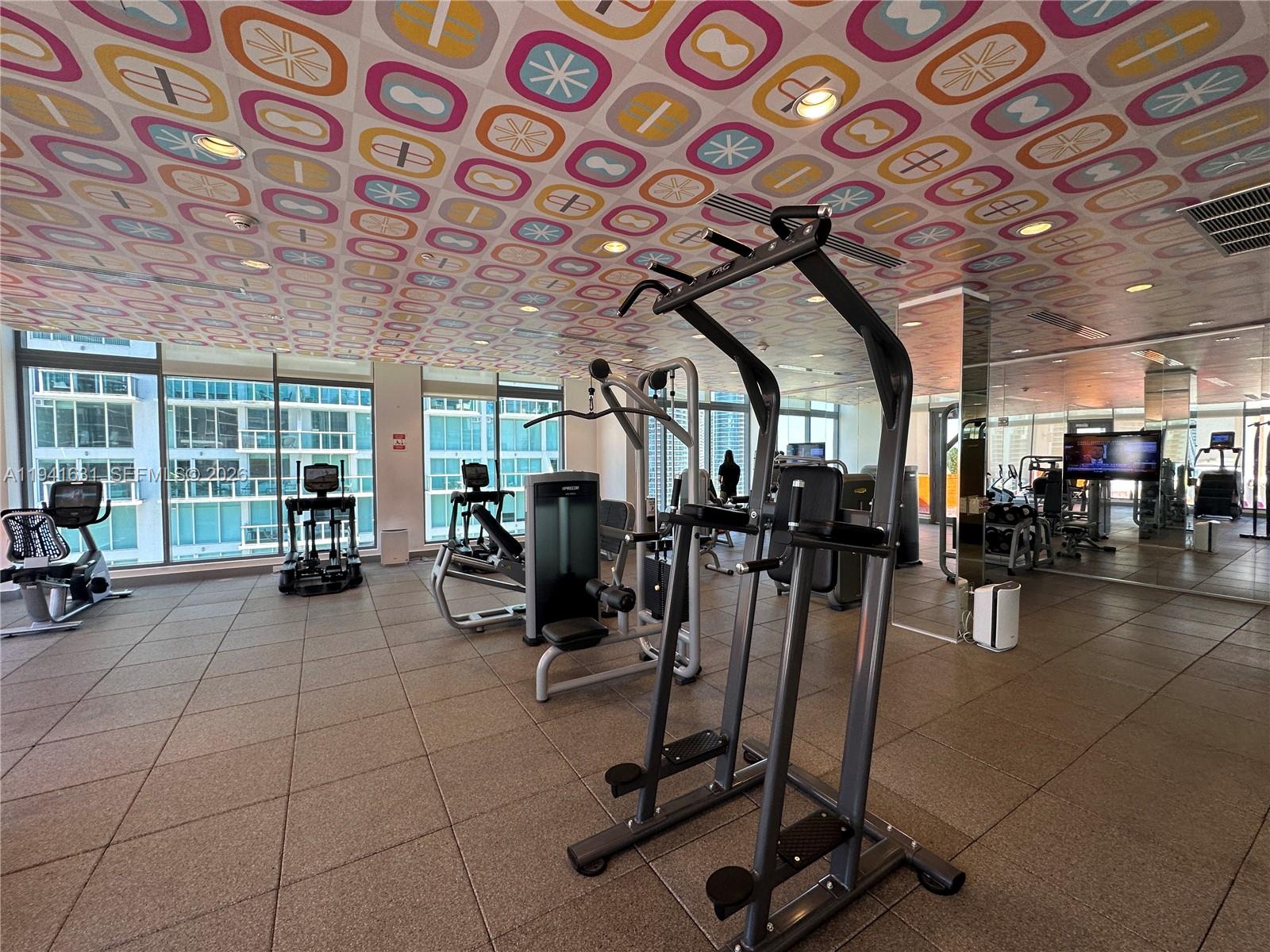 31 Southeast 6th Street, Unit 2007 Miami, FL 33131 - Photo 16 of 22 a view of a room with gym equipment
